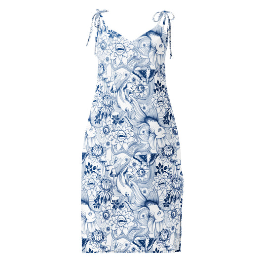 A sleeveless midi-length dress with a V-neckline and self-tie shoulder straps, featuring a detailed dark blue ink illustration pattern on a white background. The surreal pattern includes large goldfish, moths, mushrooms, and whimsical flowers with teeth and eyes.