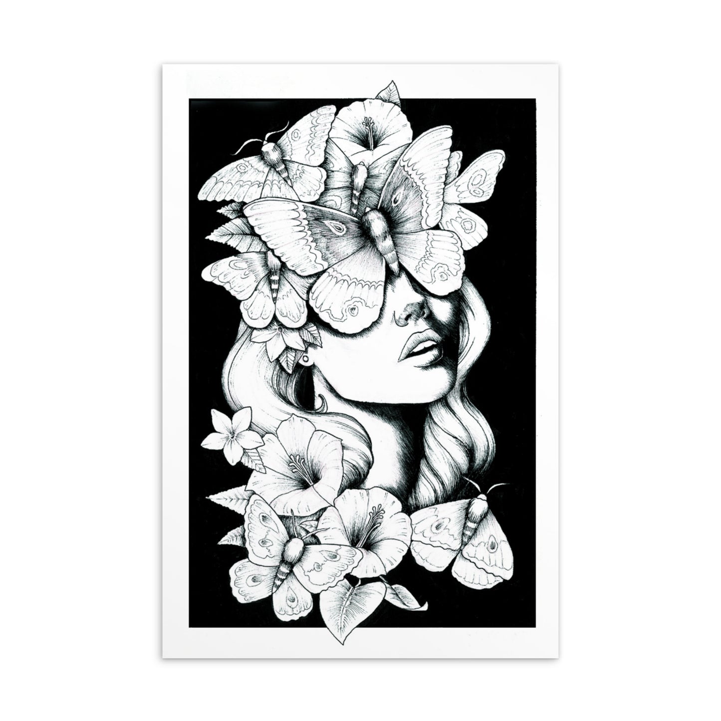 A black and white ink illustration of a woman's face surrounded by large moths and blooming hibiscus flowers against a solid black background. The moths cover her eyes, creating a surreal and mystical garden aesthetic.