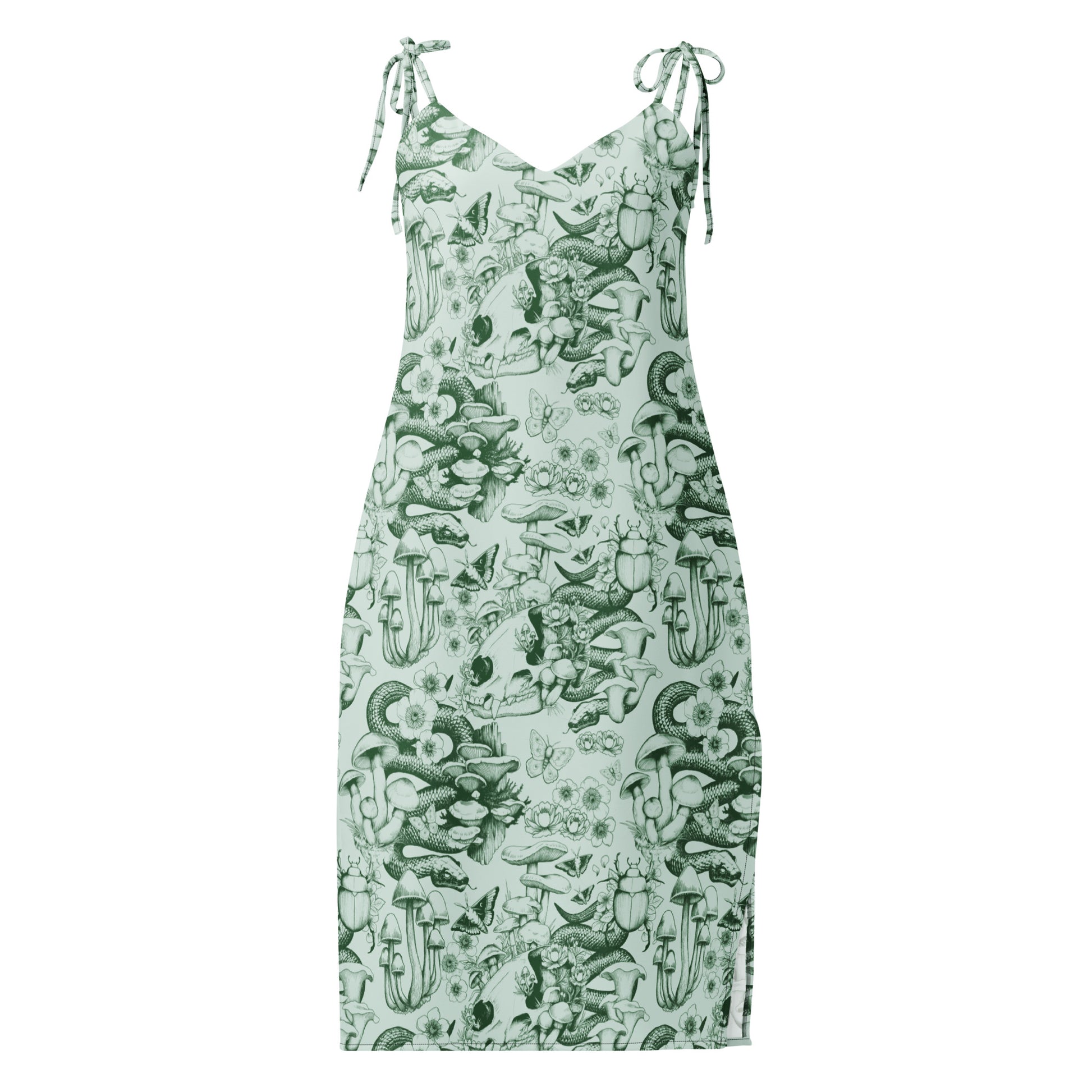 A sleeveless midi-length dress with a V-neckline and self-tie shoulder straps, featuring a detailed sage green ink illustration pattern on a light green background. The moody nature pattern includes human skulls, coiled snakes, beetles, butterflies, and various wild mushrooms and flowers.